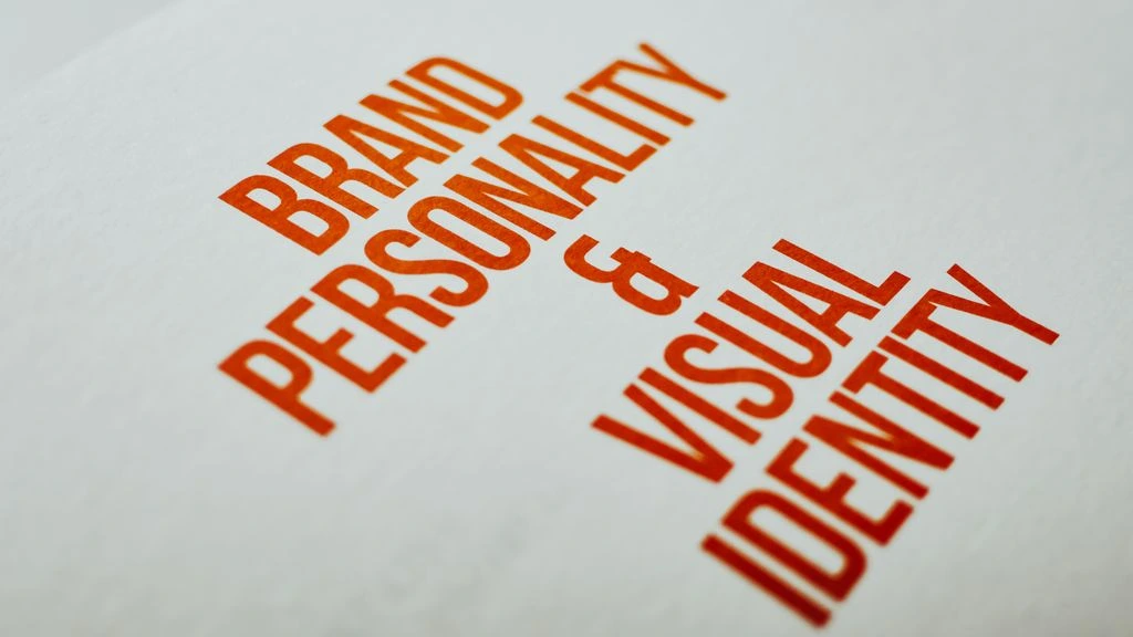 Brand identity specimen sheet, duotone navy and rust